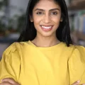 young s confident indian woman smiling looking camera young s confident indian woman smiling looking camera exuding 394618728